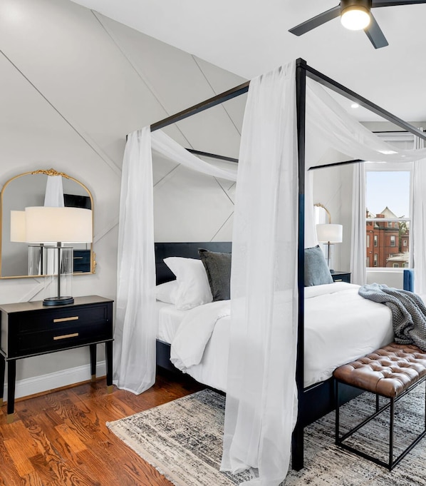The Lincoln Room: a meticulously designed master suite adorned with a King size canopy bed & plush, luxurious bedding - truly a room fit for the President