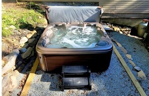 Hot tub seats 8 only steps from Blue Mountain Retreat patio and sliding door.