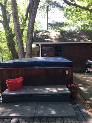 Hot tub located on main house deck near master bedroom.