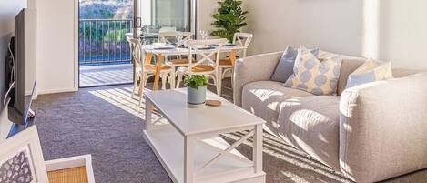 Sunbathed Living and Dining Spaces, with Ranch Slider onto Private Balcony