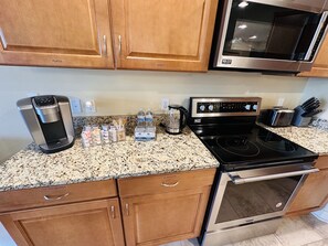 Kitchen counter with coffee, hot water and toaster