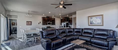 Open layout with beautiful kitchen, living room & dining area w/seating for 12