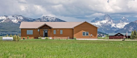 Take in beautiful, unobstructed views of the Tetons from the comfort of this well-appointed family home.