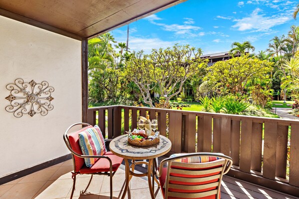 Spacious lanai with lush garden views