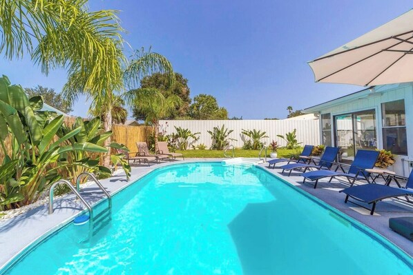 Relaxing pool oasis with lush palm trees