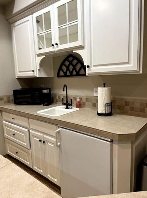 counter space, small sink, mini fridge, microwave, electric skillet, crock pot