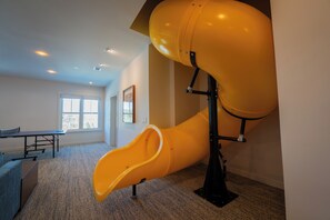 Have fun going down the tube slide inside your rental home!