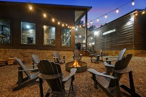 Fire pit off of the main deck w/string lighting! 