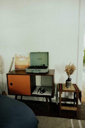 Vintage Vibes: Spin your favorite records on a stylish turntable in this chic space!