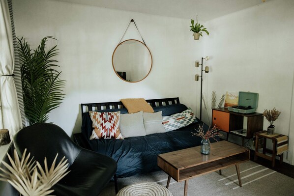 Living Room: Modern decor and inviting vibes await! Perfect spot for relaxation and fun times!