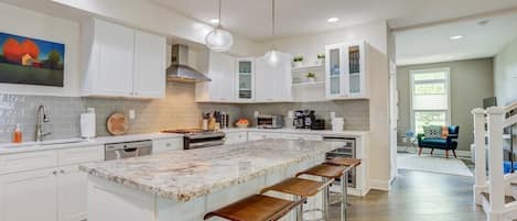 Step into a kitchen where cleanliness meets elegance, with a shining, shimmering ambiance throughout. The beautiful countertop adds a touch of sophistication, making it a space that's as functional as it is visually stunning.