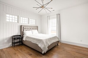 Bedroom Escape: Bright and airy room with chic decor, plush bedding, and stylish lighting for relaxation!