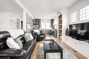 Living Room: Bright and inviting space perfect for movie nights or gathering with friends!