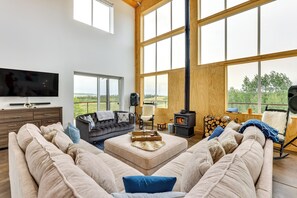 Living Room | Smart TV | Wood-Burning Stove | Ceiling Fans | Board Games