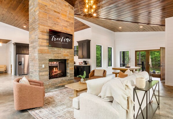 Gather around the welcoming stone fireplace, where you can enjoy the warmth and comfort of a fire after a day of exploration.