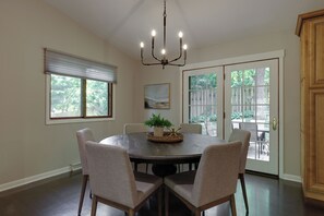 Elegant dining area with French doors leading to back yard/patio.