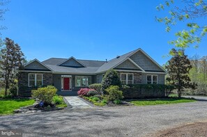 The beautifully landscaped front yard provides a warm welcome