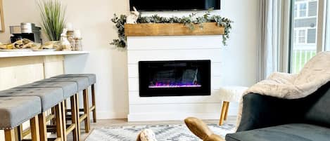 Electric fireplace and large flat screen smart TV