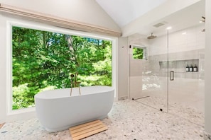 Primary bathroom with large soaking tub and walk-in shower