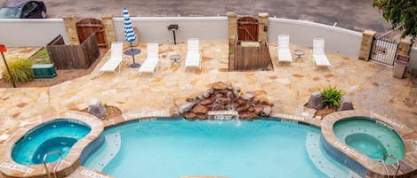 Experience blissful relaxation on our third-floor balcony, offering stunning views of 1 of the 2 guest pools and 2 of the 4 inviting hot tubs.