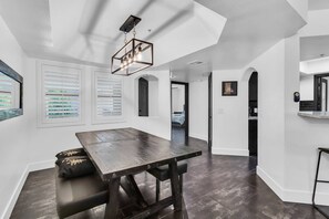 Dining table with bench seating just off the kitchen, seating for 4-6