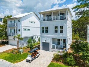 Luxurious 3-Story Vacation Rental with Open-Concept Living Spaces and Golf Cart