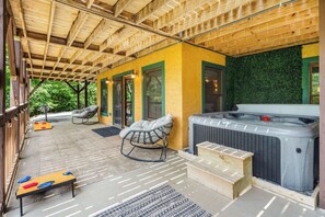 Unwind with a soak in the year-round hot tub or a friendly game of cornhole on the shaded lower patio.