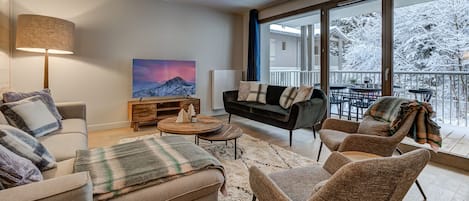 Living area with glass doors onto balcony