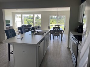 Dishwasher available with pods. Enjoy complimentary water & sparkling water. 