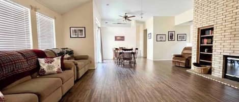 Spacious living room with fireplace and 50" tv