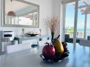 This ding table is adorned with a stunning centerpiece. Delicately crafted and elegantly displayed, this centerpiece adds a touch of sophistication and beauty to your dining experience. Enjoy the visual feast as you gather around the table and create memorable moments in style.