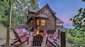 Fire pit has 12 adirondack chairs and a mountain view. BYO firewood