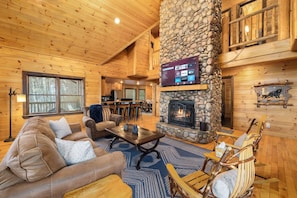 [Main Level: Living Room] 65" smart TV (BYO Login). BYO firewood