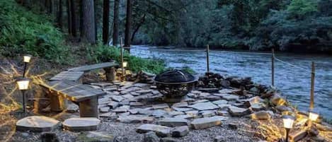 Embark on an unforgettable riverside adventure: cozy up by the crackling fire, toast marshmallows, and let the melodious river serenade your senses.