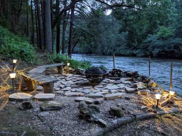 Embark on an unforgettable riverside adventure: cozy up by the crackling fire, toast marshmallows, and let the melodious river serenade your senses.