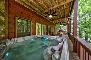 Let the bubbling waters of the hot tub melt your stress away at this serene, cozy escape.