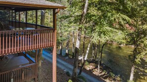 Take in the nature around you on this riverside deck, tucked away in tranquility.
