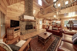 Experience the charm of this picture-perfect open-concept space, highlighted by a striking fireplace that enhances the inviting atmosphere.