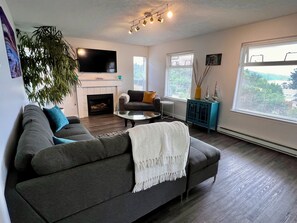 Living room with pullout queen bed.