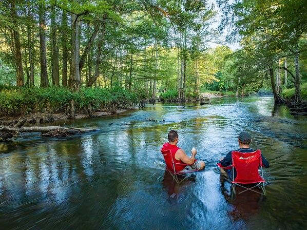 Summertime at the River is the best.  This is right below the cabin for you to go sit at .