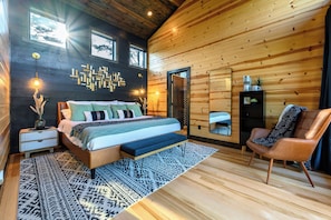 Upper level king bedroom with ensuite bathroom and private deck