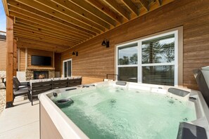 Our hot tub, located on the covered back patio, is fully drained and sanitized between each stay. You will love lounging here on chilly evenings and rainy days!