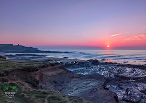 Atmospheric sunset over Crooklets and Summerleaze beaches, Bude.