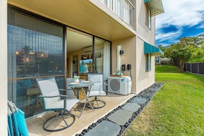 Ground floor lanai features seating for two