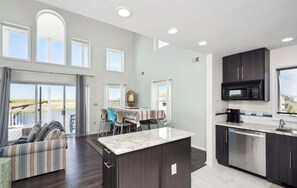 Kitchen looking into dining area and living area. 