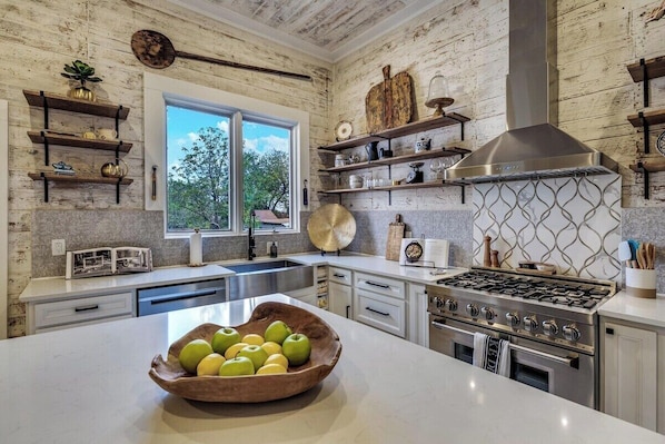 14' Ceilings with Gas stove/Dishwasher/Microwave/ coffee pot or single. All the cooking supplies needed for a Gourmet Meal. If you like to cook this is your Dream Kitchen.