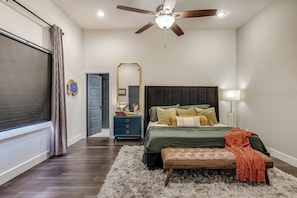 Master Bedroom with king-size bed, adjoining master bath, and walk-in closet.