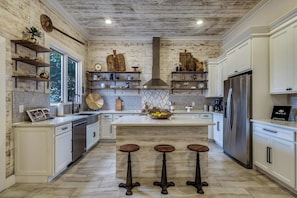 Let's Cook! Dream Kitchen ready to use the 6 burner Gas Grill. Great for entertaining. Large Pantry.