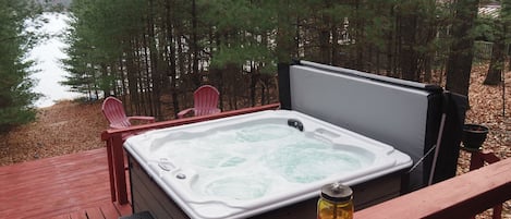 OVERALL:  The wonderful new year-round hot tub / spa with the private lakefront in the background.