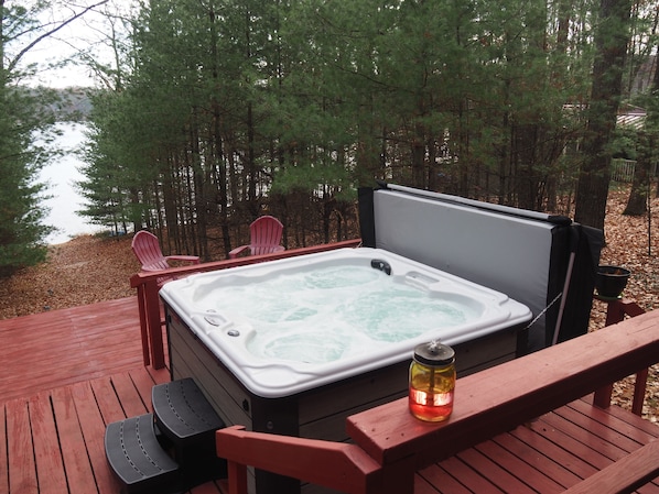 OVERALL:  The wonderful new year-round hot tub / spa with the private lakefront in the background.